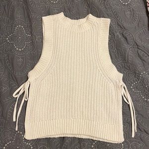 White sweater top with open sides